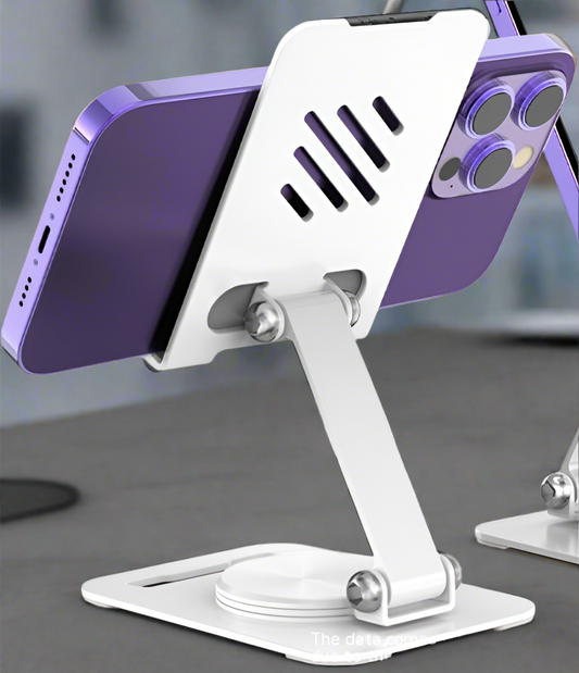 White phone stand holding a purple smartphone on a blurred background