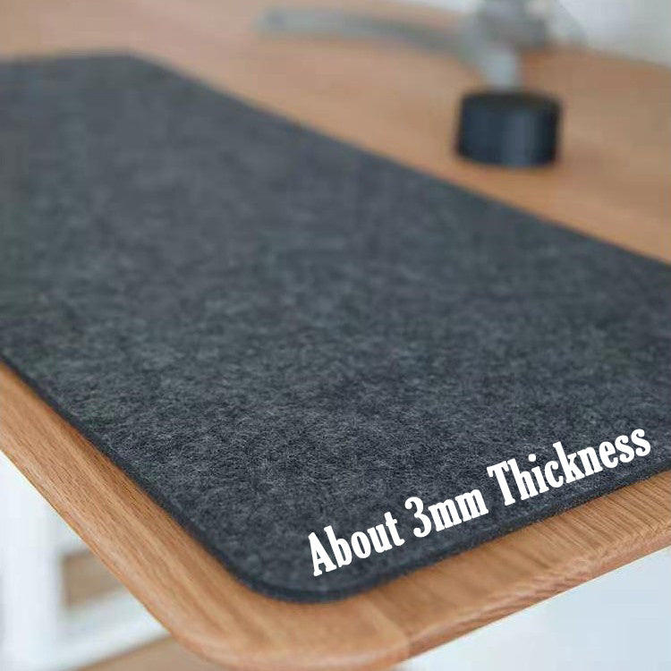 Black wool mat with 'About 3mm Thickness' text on a wooden surface
